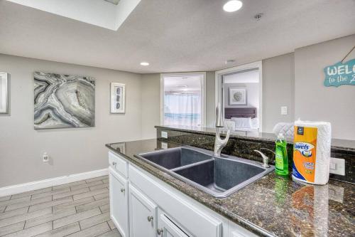 a kitchen with a sink and a counter top at Oceanview Paradise at the Beach in Myrtle Beach