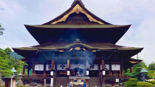a large building with a roof on top of it at Toyoko Inn Nagano eki Zenkoji guchi in Nagano