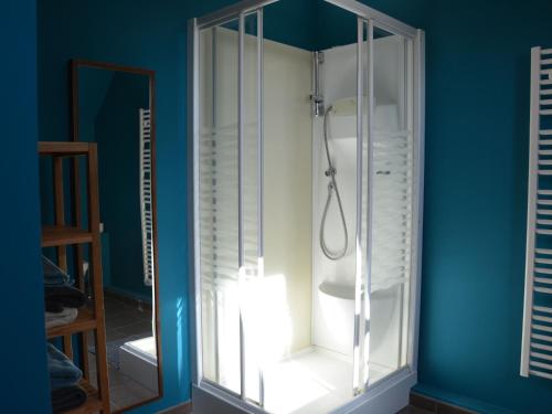 a shower with a glass door in a bathroom at Maison lumineuse pour 4, près d'Orléans et Chartres, avec cour, terrasse, parking, et équipements complets. - FR-1-581-23 in Oinville-Saint-Liphard