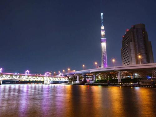 a view of a city with a tv tower at night at WEB Hotel Tokyo Asakusabashi - Vacation STAY 13758v in Tokyo