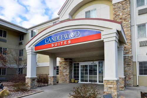 a building with a sign for a car dealership at Candlewood Suites Boise-Meridian by IHG in Meridian