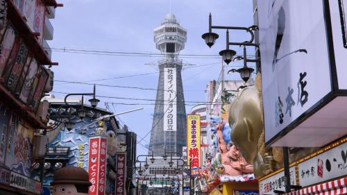 a busy city street with a tower in the background at Toyoko Inn Osaka Abeno Tennoji in Osaka
