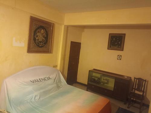 a hotel room with a bed and a tv at Best Place Have Air Conditioner in Bangkok