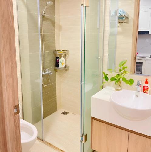 a bathroom with a glass shower and a sink at Homestay Vinhome Ocean Park - Pearl house S108 in Hanoi