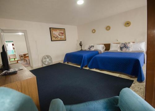 เตียงในห้องที่ Hotel Boutique Catalina's House