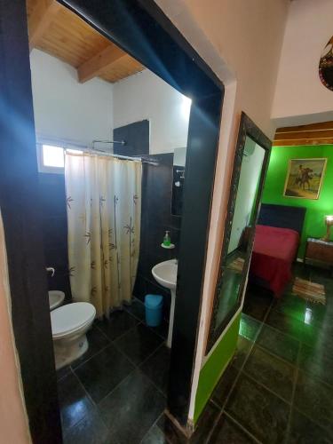 a bathroom with a toilet and a sink at tranquilidad absoluta in Villa Unión