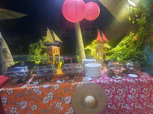 a table with a table cloth with a tableablish at Explora Prestige in Blue Bay