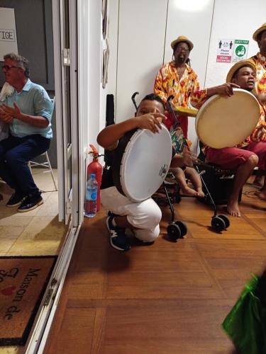 a man playing drums in front of a group of people at Explora Prestige in Blue Bay