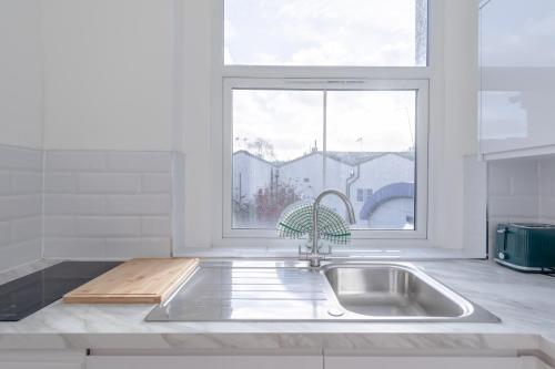a kitchen with a sink and a window at HAFH in Paddington - Double studio 1 in London