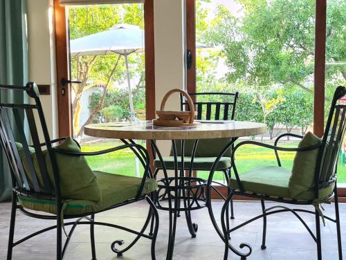 a table and chairs with a purse on top of it at Apartments Aerodrom in Podgorica