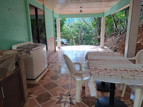 a dining room with a table and chairs in a house at CASA EQUIPADA SAN IGNACIO DE ACOSTA 