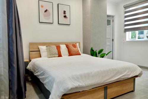 Katil atau katil-katil dalam bilik di Avila Apartment - Central District 1
