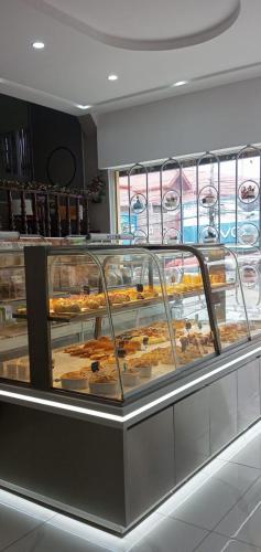 a display case with many different types of pastries at Dansavanh Hotel in Muang Xai