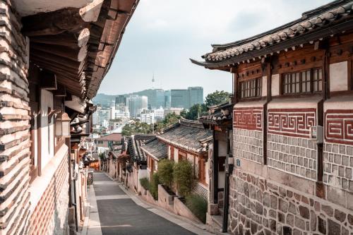 an alley in an asian city with buildings at JD Tower Hotel in Seoul