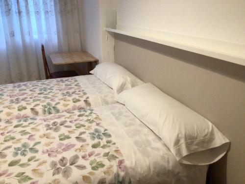 Llit o llits en una habitació de Piso Cuatro Caminos
