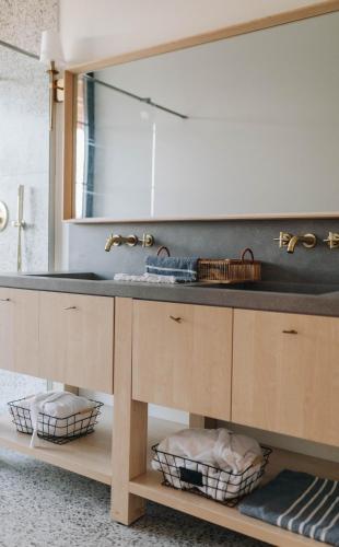 a bathroom with a sink and a mirror at Hilltop Munteni in Munteni