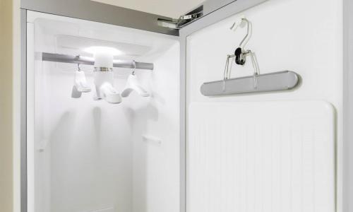 a bathroom with a shower with a glass door at Dongtan BobosHotel in Hwaseong