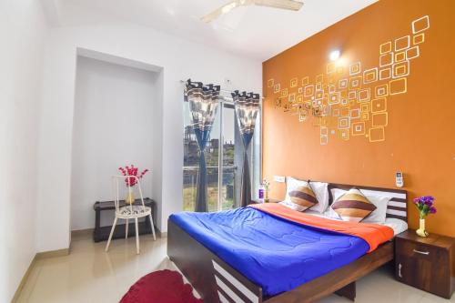 a bedroom with a bed and a large window at EMPYREAN STAY ll 2BHK ll PRIVATE POOL ll GOOD LUCK VILLA ll FREE BREAKFAST in Lonavala
