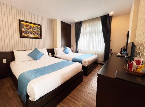 Giường trong phòng chung tại Thien Ly Hotel - Da Lat Center