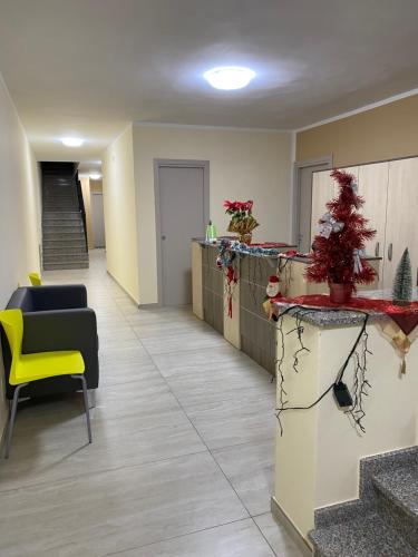 a hospital hallway with a yellow chair and a counter at Sogni d'insonnia in San Sosti