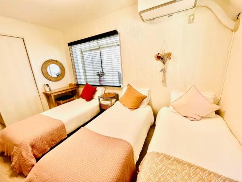 Cama ou camas em um quarto em YUYUSO Hostel