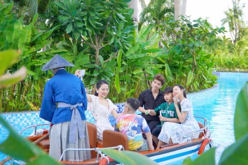 a group of people on a boat in the water at Da Nang - Mikazuki Japanese Resorts & Spa in Da Nang