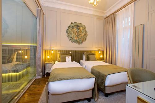 Una cama o camas en una habitación de Ayramin Exclusive Hotel - Special Category