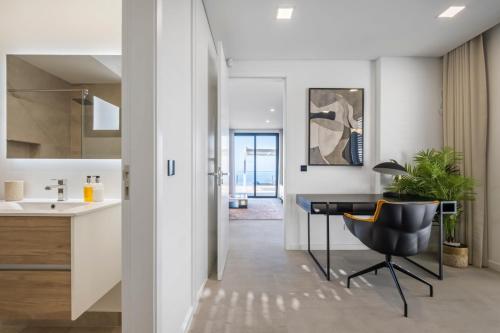 an office with a desk and a chair in a room at Villa Boa Nova Branca by LovelyStay in Funchal