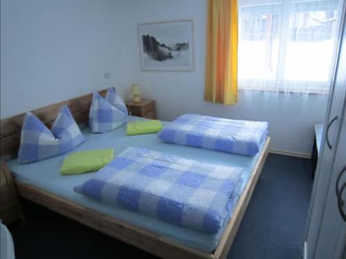 Krevet ili kreveti u jedinici u okviru objekta Haus Biggi - Ferienwohnung Pfänder