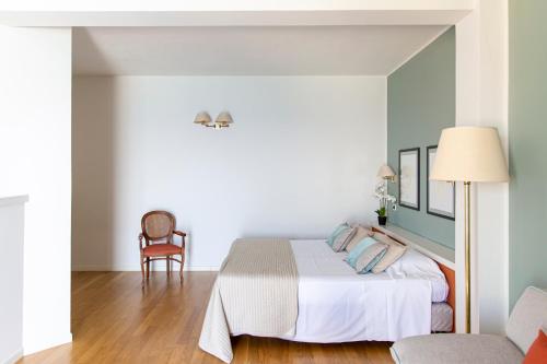 Una cama o camas en una habitación de Hotel Punta Nord Est