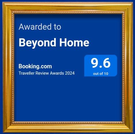 a gold picture frame with the words awarded to beyond home at Beyond Home in Kozhikode