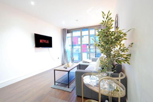 A seating area at Stylish 2-Bed In Central Wembley Ideal For Families, Leisure & Business