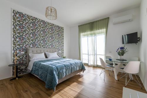 Postel nebo postele na pokoji v ubytování Cas’ A Mare - Beachfront Luxury Suites