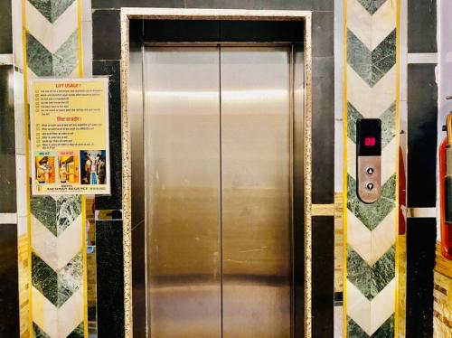 a stainless steel elevator in a subway station at Aachman velly view with terrace in Shimla