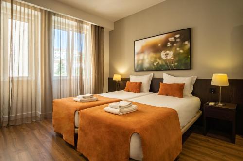 Katil atau katil-katil dalam bilik di Riversuites
