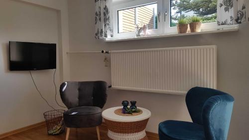 TV a/nebo společenská místnost v ubytování Ferienwohnung "Münsterblick"