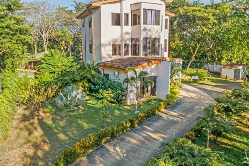 an aerial view of a house with a driveway at Playa Negra Peaceful & Luxury Beach Dream Penthouse in Playa Negra