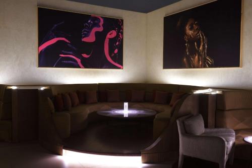 a living room with a couch and a table at Hilton Taghazout Bay Beach Resort & Spa in Taghazout