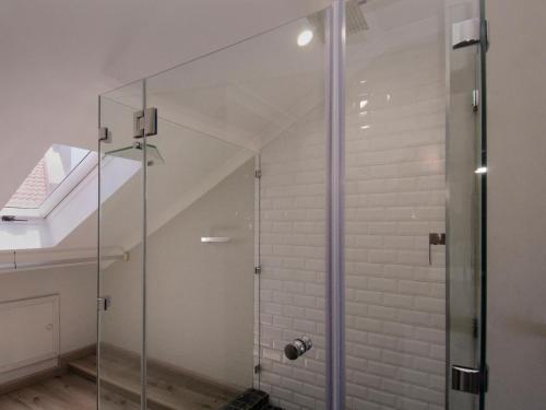 a shower with a glass door in a bathroom at 809 Umdloti Beach Resort in Umdloti