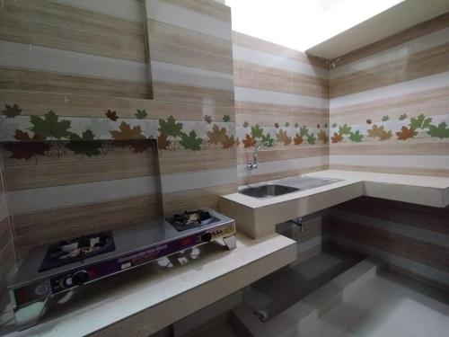 Ванная комната в New Hotel Shapno Nibash