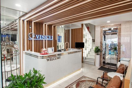 a store lobby with a welcome counter in a store at Venice 1 Hotel in Ho Chi Minh City