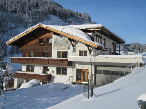 a house in the snow with snow at Lärchenhof in Steeg