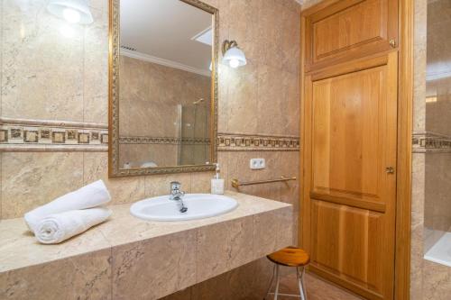 a bathroom with a sink and a mirror at Can Serra 4 -Santa Margalida- in Santa Margalida