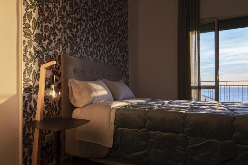 Postel nebo postele na pokoji v ubytování Cas’ A Mare - Beachfront Luxury Suites