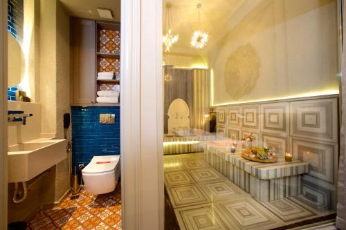 a bathroom with a toilet and a sink at Ayramin Exclusive Hotel - Special Category in Istanbul