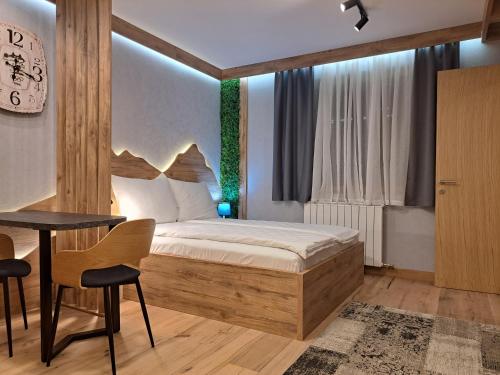 Postel nebo postele na pokoji v ubytování Aparthotel Vucko Jahorina NEW 451