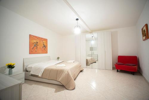 En eller flere senge i et værelse på Appartamento In Piazza