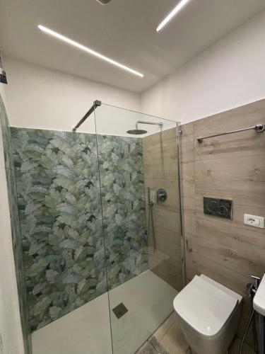 a bathroom with a shower and a toilet at c'est la vie giardini in Giardini Naxos