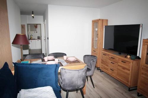 A television and/or entertainment centre at apartament 1000-lecia