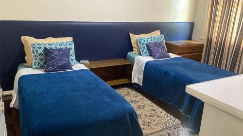 Łóżko lub łóżka w pokoju w obiekcie Apto aconchegante com 3 dormitorios bem localizado